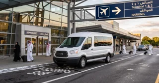 Passenger van at an airport terminal for Rana Transportation’s Umrah taxi service and private airport shuttle