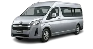 Silver Toyota Hiace for Rana Transportation Hajj & Umrah Taxi Service and 11-seat pilgrim shuttle.